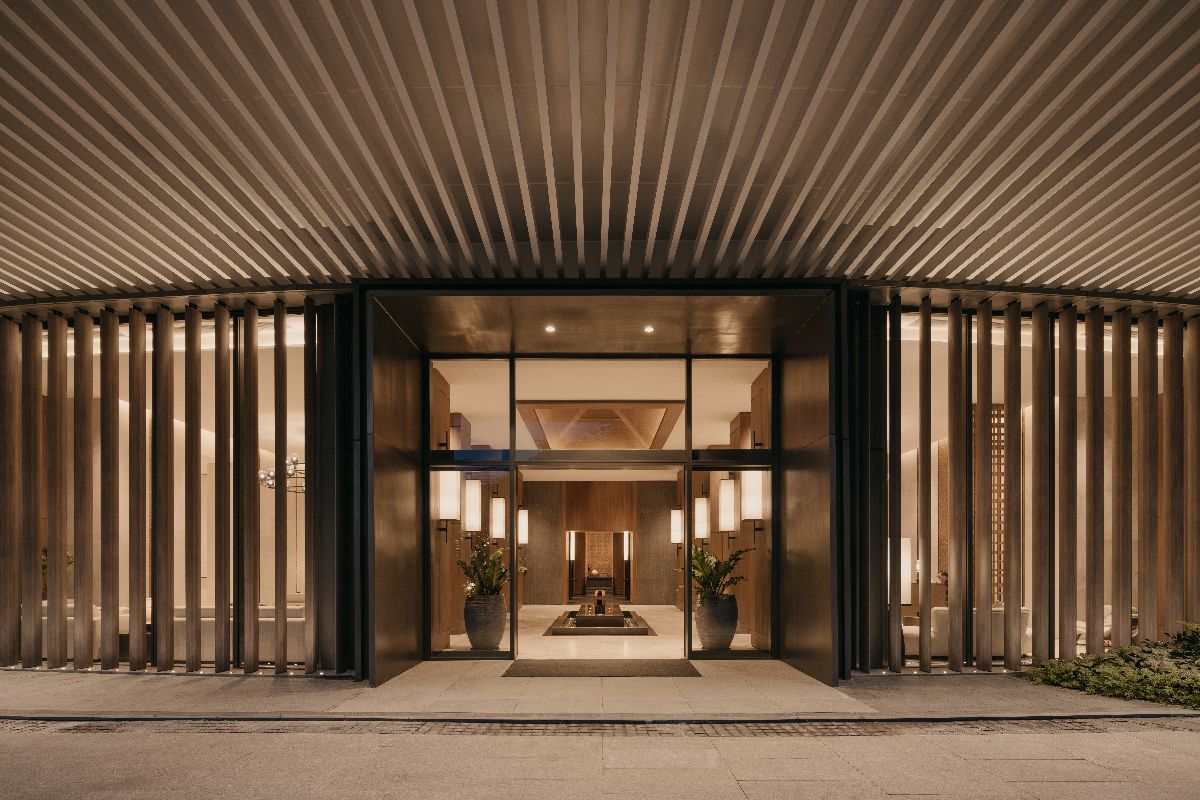 Grand entrance of Shang Residences at Wack Wack with warm lighting, wood details, and refined architectural design